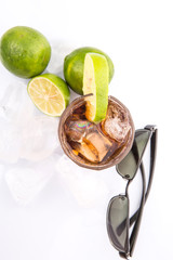 Cola drinks, sunglasses, lime and ice cubes