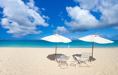 Chairs and umbrella on tropical beach