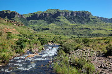 Fototapeta na wymiar Mountain with flowing river, Drakenberg mountains