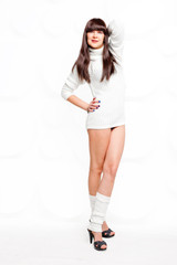 brunette in a warm sweater on a white background