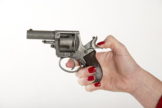 Woman cocking a gun