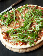 Pizza Margherita with Fresh Arugula Leaves