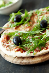 Closeup of Pizza Margherita with Arugula and Olives