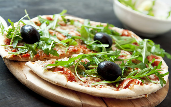 Pizza Margherita with Fresh Arugula Leaves and Olives