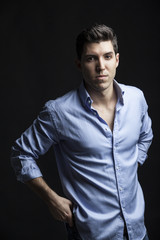 Fototapeta premium portrait of sexy man model doing a fashion shoot in the studio o