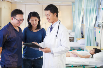 pediatrician explain kid condition to her parents