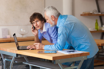 business man working on laptop with Colleges indoor