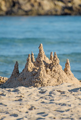 Fototapeta na wymiar Sand castle on the beach.