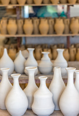 Fototapeta na wymiar Shelves with ceramic dishware