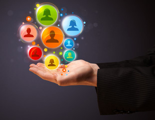 Social network icons in the hand of a businessman