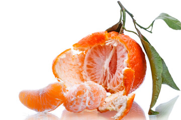 Half of a tangerine with leaf