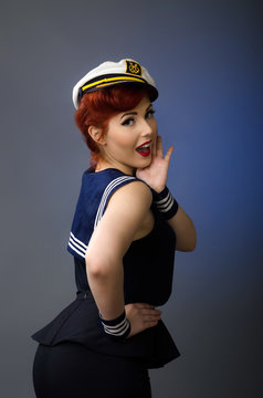 Pin up girl wearing a sailor suit