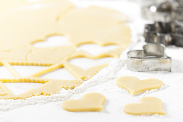 still life of dough with cookie cutters