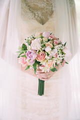 Bride holding the wedding bouquet