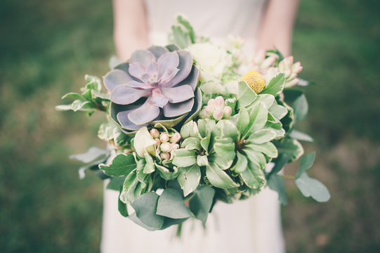 Bride Holding The Wedding Bouquet With Succulent Flowers