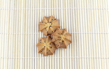 Flower cookies on bamboo mat