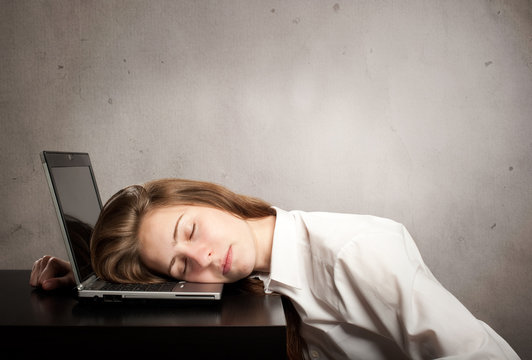 businesswoman sleeping on laptop
