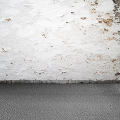 Empty grunge urban interior background. Old white wall, asphalt