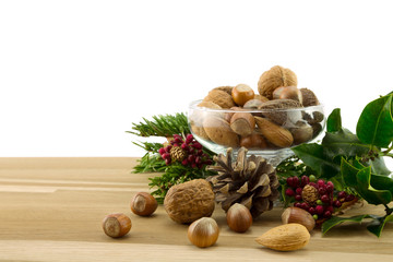 Nuts,bowl and holly.