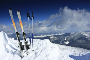 winter landscape, mountains and ski equipment