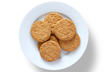 Plate of crispy golden oat biscuits