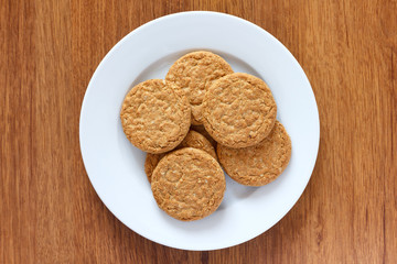 Plate of crispy golden oat biscuits