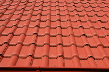 Concrete roof covered with red tiles