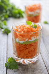 Salad from carrot and apple served in glass