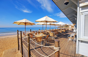 outdoor terrace cafe on sand beach, Portugal - 62656897