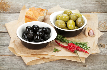 Italian food appetizer of olives, bread and spices