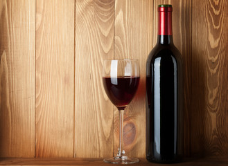 Red wine glass and bottle