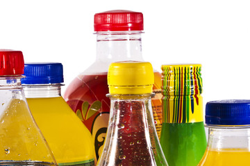 packs of soda bottles in closeup over white background