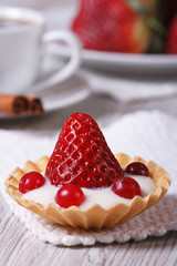 tartlet with fresh strawberries, cranberries vertical. close-up