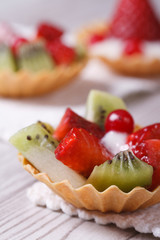 tartlets with strawberries, kiwi and cranberries vertical