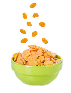 Bowl With Corn Flakes On The White Background