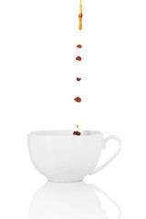 Pour coffee into cup, isolated on white