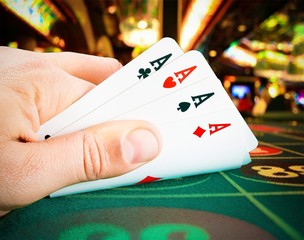 playing cards in a man hand in the casinò