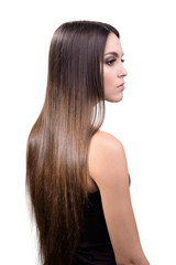 Naklejka premium Beautiful young woman with long hair isolated on white