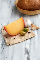 Tasty Italian cheese on wooden table