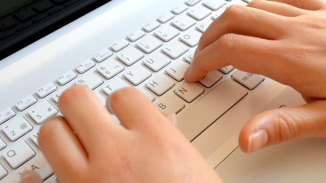 typing on a Notebook white