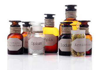 Historic old pharmacy bottles with label  isolated on white