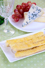 Cheese, grape and bread sticks