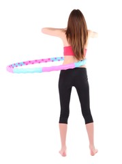 Woman doing exercises with hula hoop isolated on white