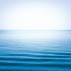 Fototapeta premium Blue sea with waves and clear blue sky