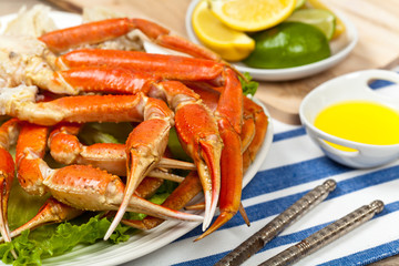 Crab legs with fresh lemon slices and butter sauce