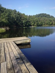 Fototapeta na wymiar Lake and small wooden pier