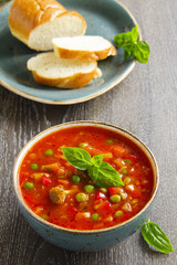 Bowl of minestrone soup with bread