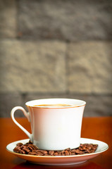 Fototapeta na wymiar coffee cup with seeds