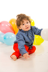 Fototapeta na wymiar Toddler boy with balloons