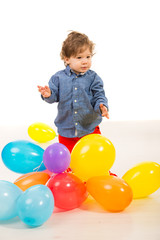 Fototapeta na wymiar Elegant baby boy with balloons